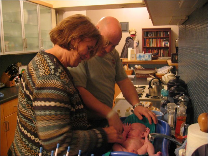 Grandma Kristal & Dad bathing Owen